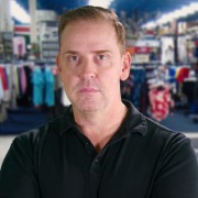 Lyle Nelson Man with reddish-brown hair in a sporting goods store